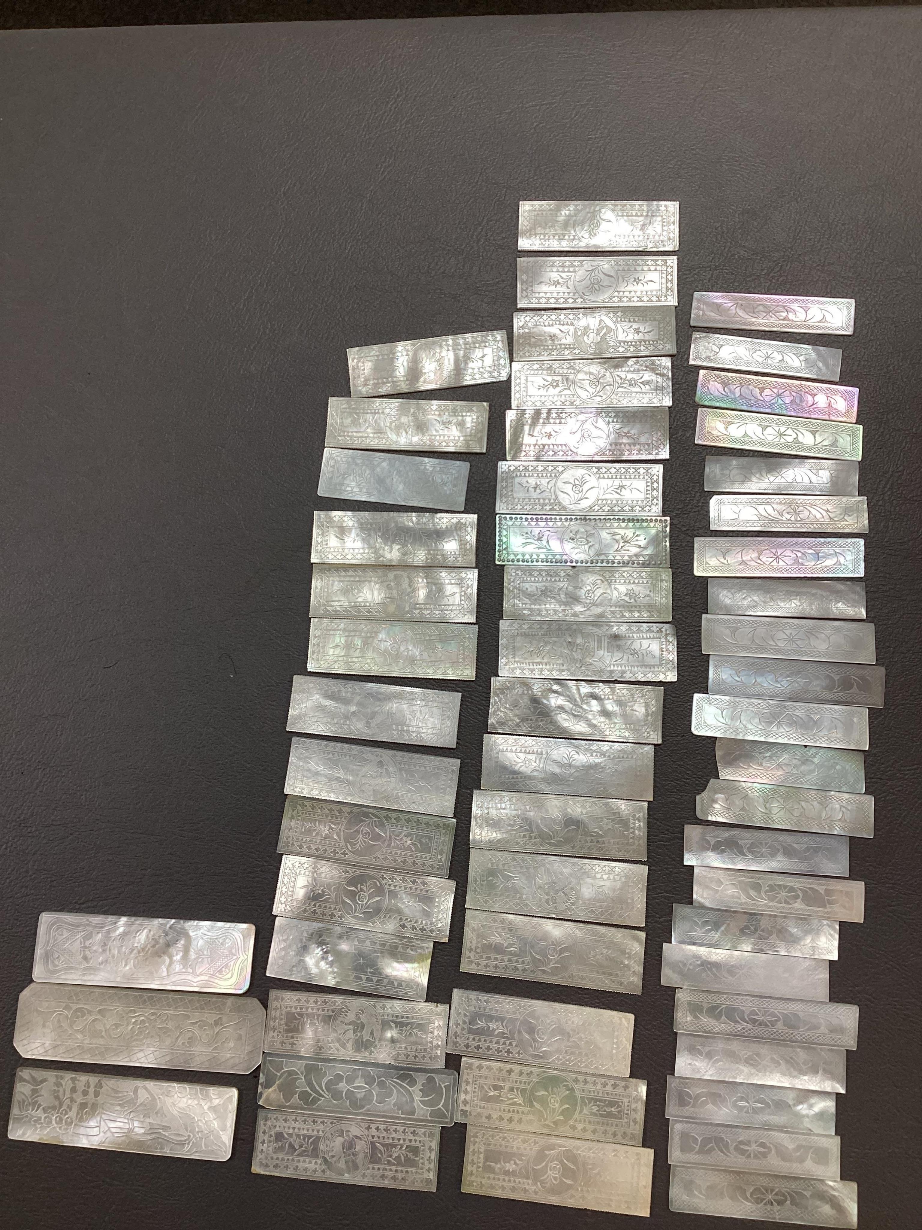 Two Chinese gilt decorated black lacquer games boxes, containing numerous mother-of-pearl counters, 19th century